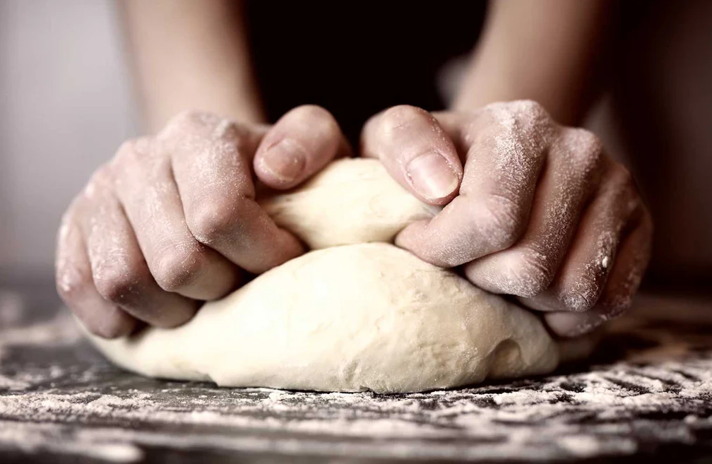 Baker kneading dough